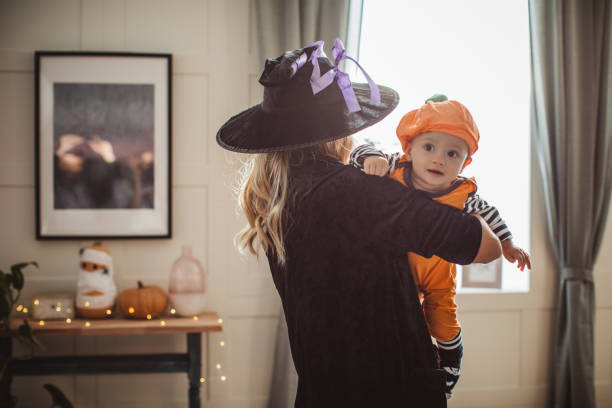 istock Mother and baby playing on Halloween 1271408718
