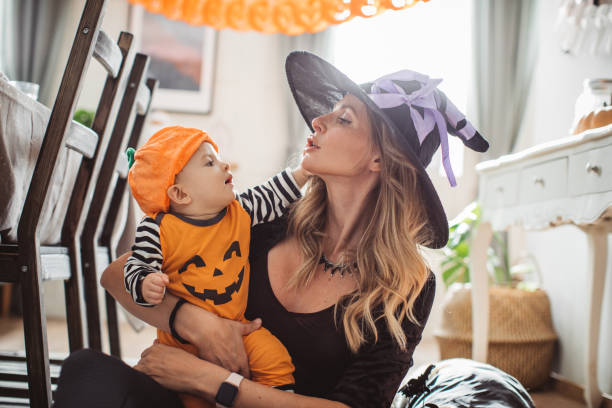 istock Mother and baby playing on Halloween 1271408770