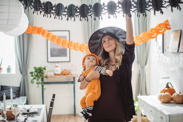 istock Decorating home for Halloween with baby 1271408787