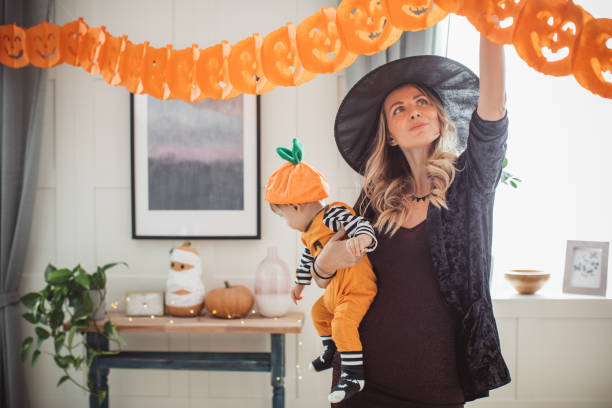 istock Decorating home for Halloween with baby 1271408805