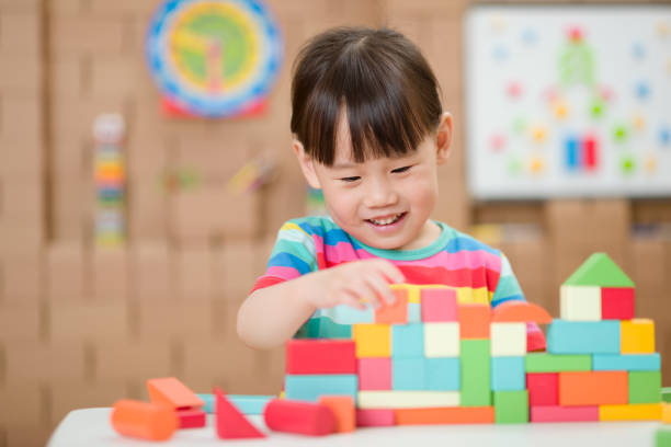 istock young girl playing creative toy blocks for home schooling 1271409660