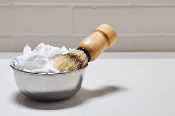 istock Bowl with shaving foam and brush on white background 1271409677