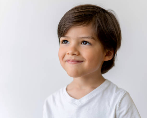 Portrait of a thoughtful boy looking up