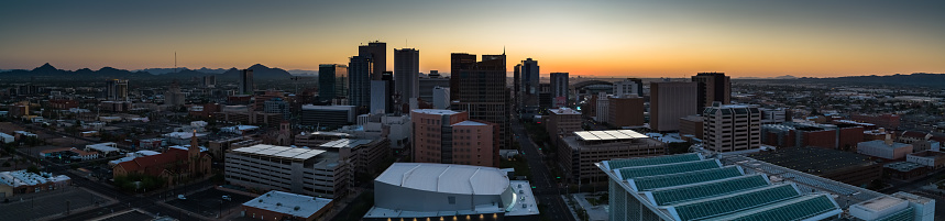 Aerial panorama of Downtown Phoenix, Arizona at sunrise.
