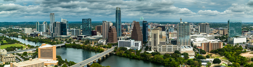 Aerial panorama of the Colorado River flowing through Downtown Austin, Texas.