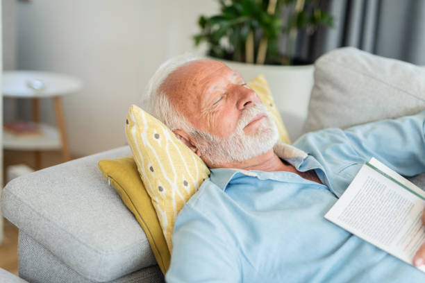 istock Senior man sleeping in the living room. 1271413328