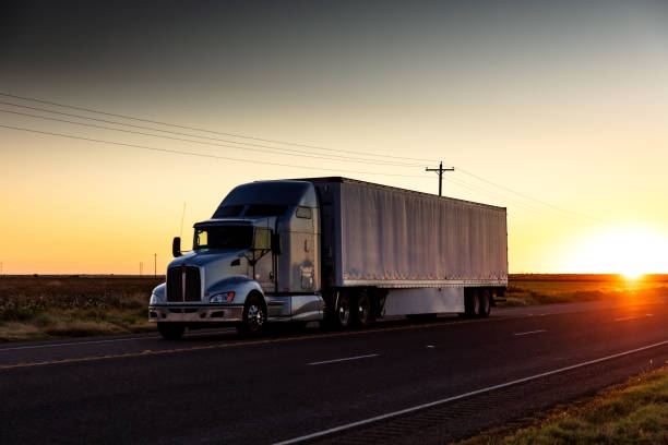 istock Setting Sun Behind Semi-Truck 1271413419