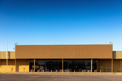 Front view of an abandoned big box store in Texas.