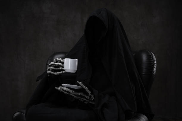 Grim Reaper drinking coffee, sitting in a classic leather chair. Funny portrait of a Grim Reaper sitting in an armchair, relaxing after long day of work. gross coffee stock pictures, royalty-free photos & images