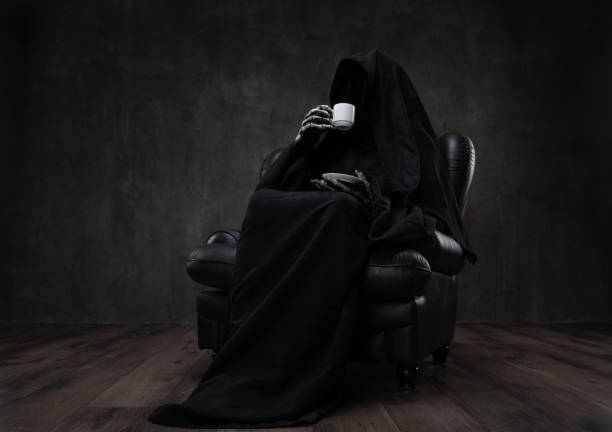 Grim Reaper drinking coffee Grim Reaper relaxing, sitting in an armchair in dark abandoned room, enjoying coffee break. gross coffee stock pictures, royalty-free photos & images