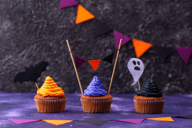 istock Halloween cupcakes with color cream 1271417350