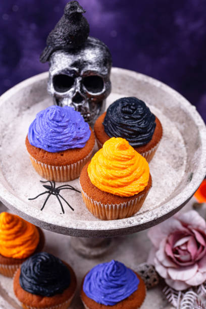 istock Halloween cupcakes with color cream 1271417358