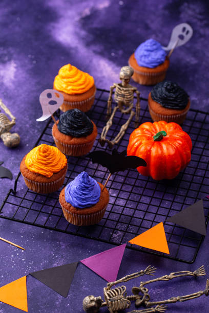 istock Halloween cupcakes with color cream 1271417363