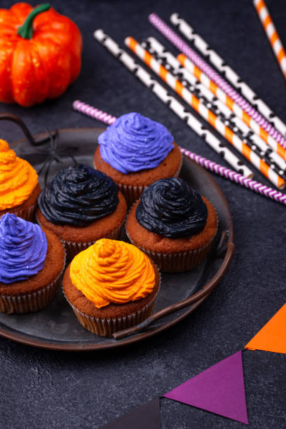 istock Halloween cupcakes with color cream 1271417368
