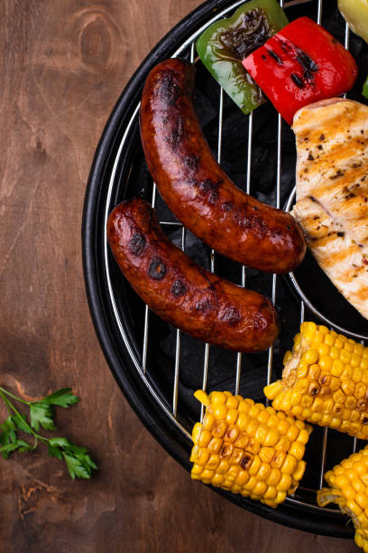 istock Grilled sausages, meat, and vegetables. 1271417413
