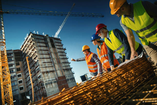 istock Group of contractors supervising building process 1271418587