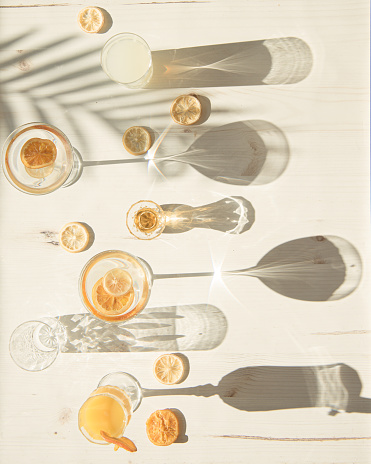 Flat lay of glasses and cups in harsh light