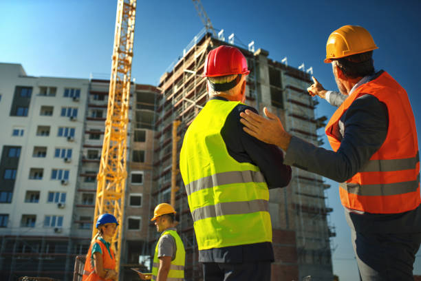 Group of contractors supervising building process