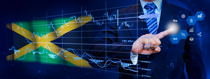 Businessman touching data analytics process system with KPI financial charts, dashboard of stock and marketing on virtual interface. With Jamaica flag in background.