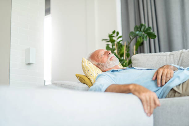 istock Senior man sleeping in the living room. 1271423877