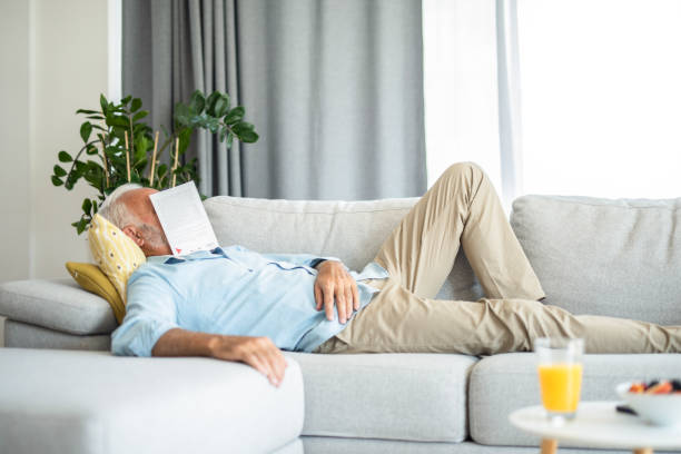 istock Senior man sleeping in the living room. 1271426292