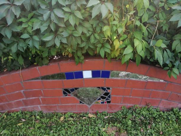 istock Brick Fence With Modern Art 1271428626