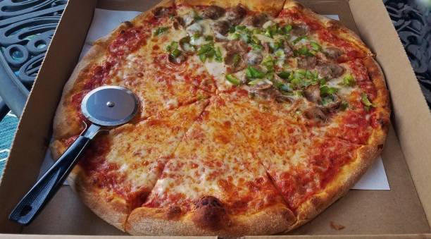 istock Large Round Pizza Close Up with Pizza Cutter to Side 1271429244