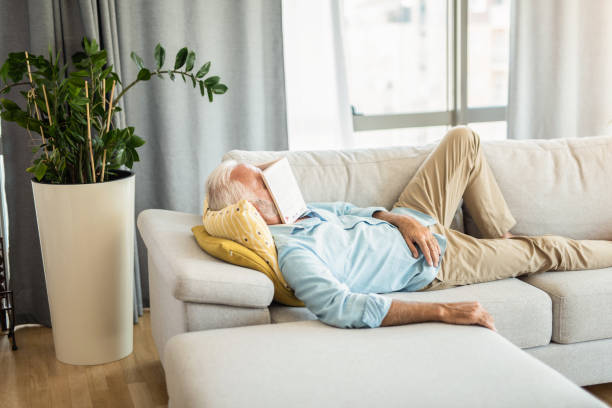 istock Senior man sleeping in the living room. 1271430092