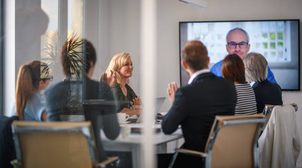 istock Happy Executive Team Applauding Good News from CEO 1271430996