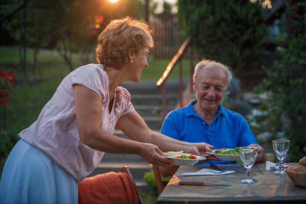 istock Senior couple having a healthy meal 1271431582