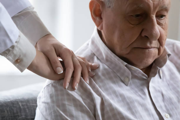 istock Compassionate young female doctor supporting depressed old retired patient. 1271431648