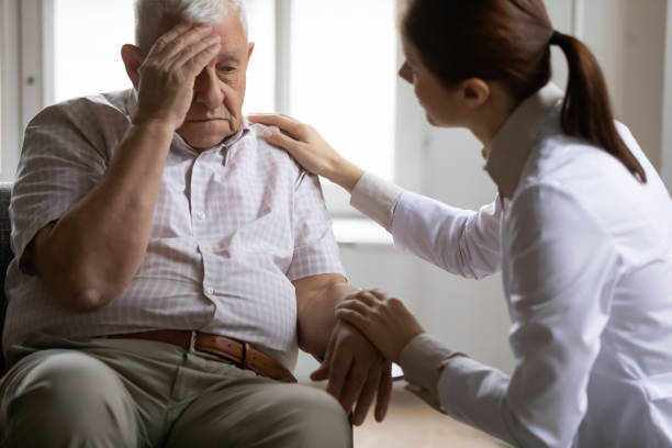 istock Unhealthy mature old patient complaining about head ache. 1271431651