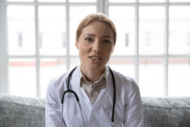 istock Pleasant happy young general practitioner holding video call with patient. 1271431657