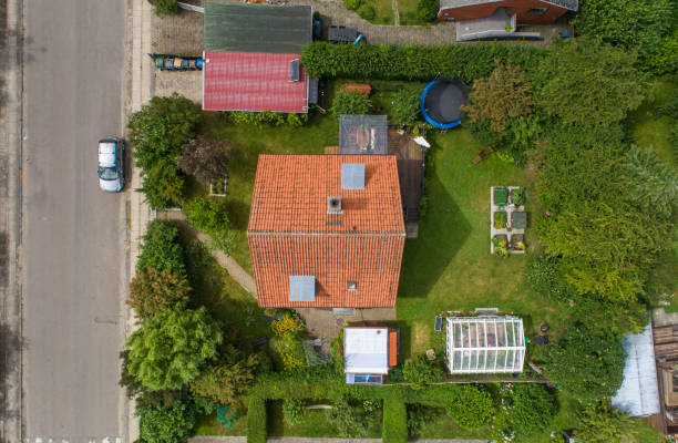Examination of the roof of a house with a drone, aerial photograph, from the roof of a detached house. drone over house