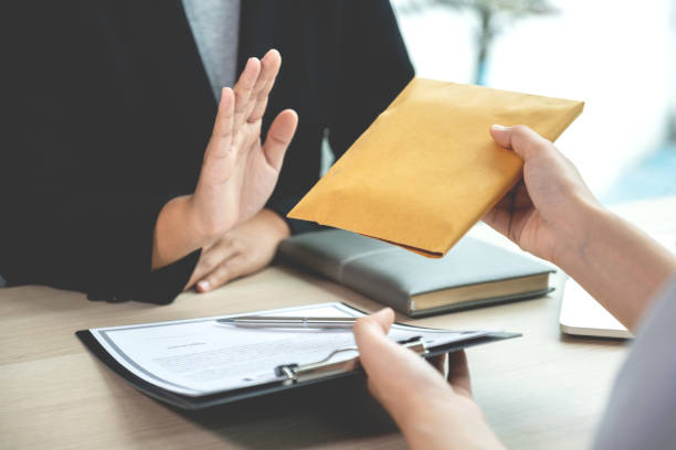 Government officials refusing money to take the bribe money from business man the concept of corruption and anti bribery Government officials refusing money to take the bribe money from business man the concept of corruption and anti bribery. corruption stock pictures, royalty-free photos & images