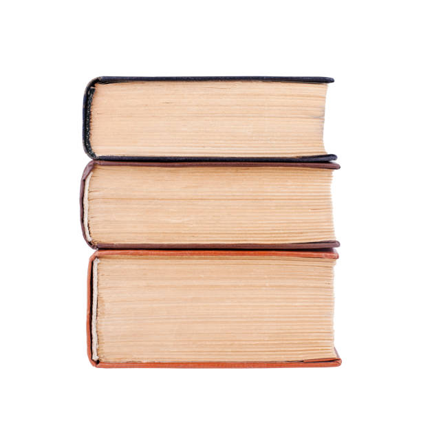 istock Three closed old thick paper books with yellow pages white background isolated close up, book heap, pile, stack, vintage hardcover textbooks, education symbol, read & study sign, library literature 1271437725