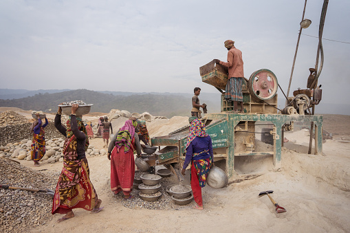 Jaflong / Bangladesh - January 28, 2019: Bengali women working hard in the stone industry for construction purposes