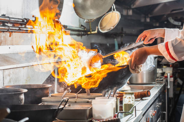 istock Chef stir fry cooking 1271454489