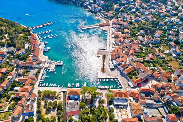 Town of Jelsa bay and waterfront aerial view, Hvar island Town of Jelsa bay and waterfront aerial view, Hvar island, Dalmatia archipelago of Croatia jelsa stock pictures, royalty-free photos & images