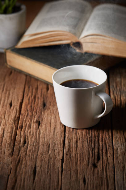 istock Cup of coffee with book 1271455387