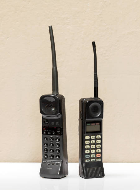 istock Two old black vintage mobile phones 1271457795