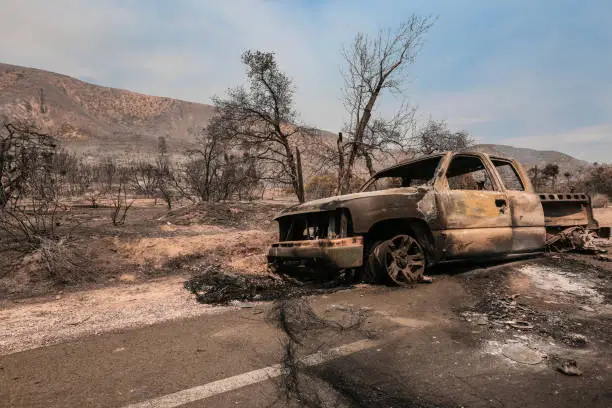 Photo of Azusa wildfire damaged to cars and homes