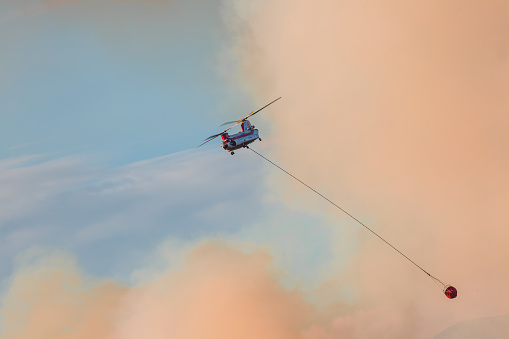 At 0% containment, the fire has burned more than 10,000 acres as of Tuesday night with red flag warnings issued due to the windy conditions. Super Scooper amphibious firefighting aircraft picking up water from a lake. \