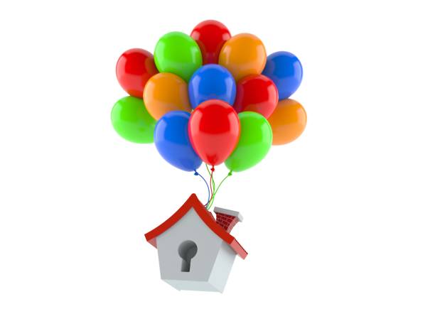 istock Small house with colorful balloons 1271460088