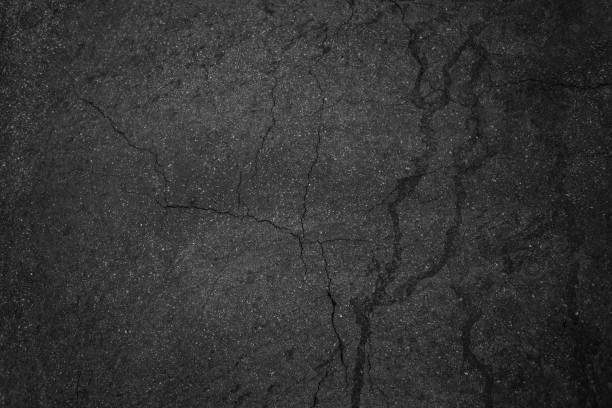 istock Crack background texture of rough asphalt top view 1271461910
