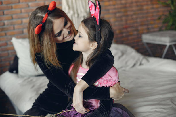 istock Mother with daughter in a halloween costume and makeup 1271461966