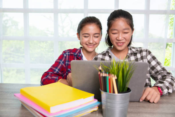 istock Teenager students girls enjoy studying with computer pc at home, Online learning new normal concept 1271462596