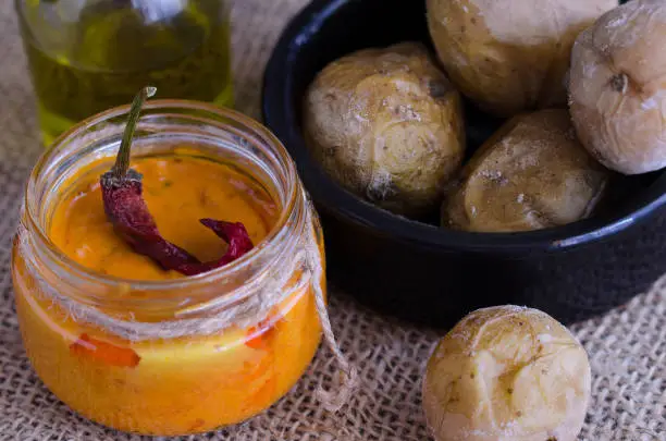 Photo of Local Canary Islands dish, Papas Arrugadas (wrinkly potatoes) with Mojo picon (red sauce).