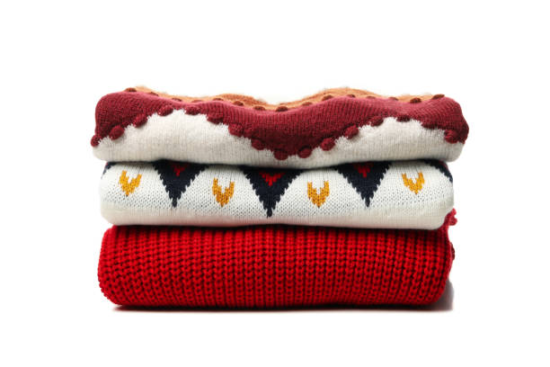 istock Pile of sweaters isolated on white background 1271464877