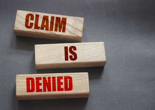 istock Claim is denied on Wooden Blocks on dark grey background with copyspace. The answer is No. Business financing sponsorship concept 1271467100